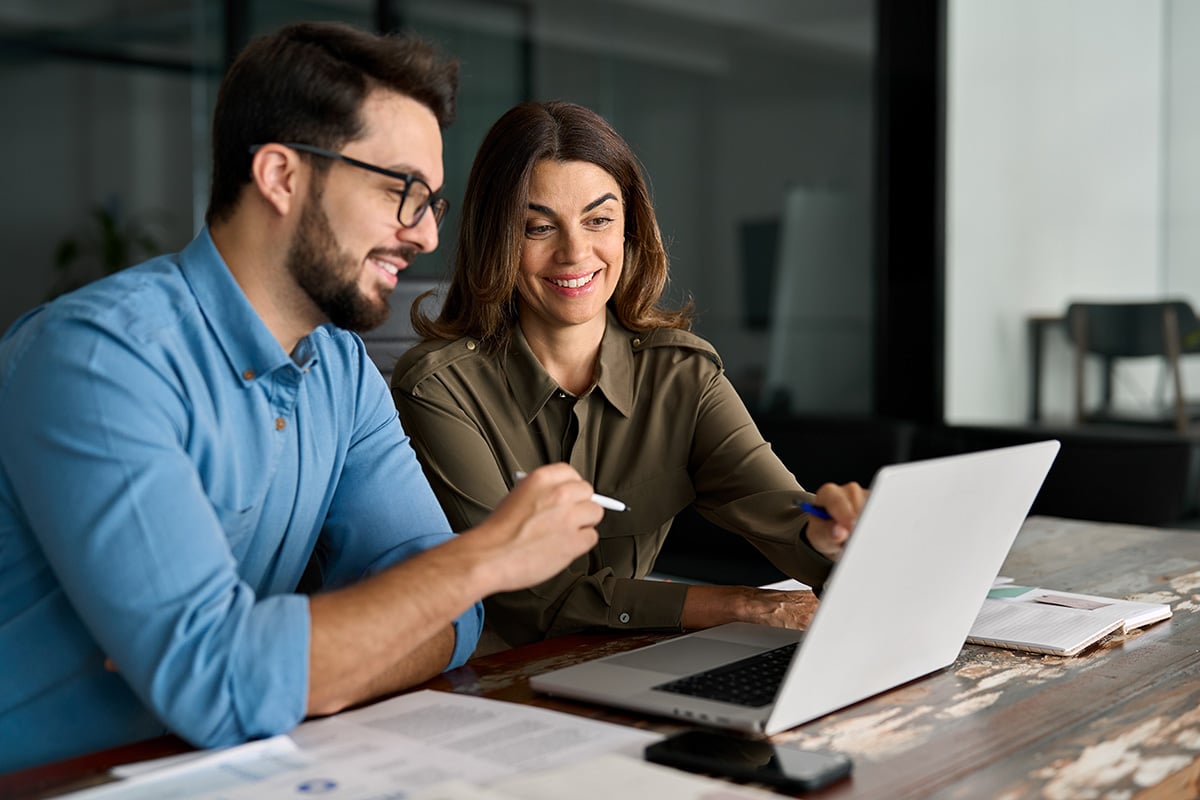 two businesspeople with a computer